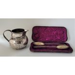 A large silver jug, by C J Vander Ltd, London 1937, height 11.1cm, together with a matched pair of