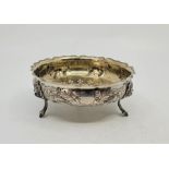 A Victorian silver bowl, by Henry Holland, London 1878, repousse birds and foliage to side, with