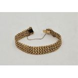 An 18ct. gold woven bracelet, width 13.5mm x 19cm. (39.0g)