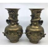 A pair of  Chinese bronze vases, together with a similar bronze vase. H:25cm (3)