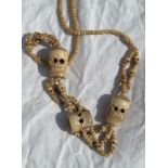 A Sino Tibetan bone skull necklace
