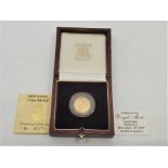 An Elizabeth II 1987 10 pounds Britannia 1/10oz. proof gold coin, rev. Britannia standing by
