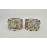 A large pair of George IV silver wine coasters, by Benjamin Smith, London 1824, having pierced and