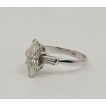 An 18ct white gold and diamond ring, claw set marquise cut diamond to centre (approx. 11mm x 5mm x