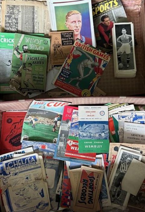 A large suitcase full of vintage football , cricket, boxing Athletic interest to include a scarce