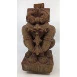 An East Asian carved wood figure. H:27cm