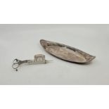 A George III silver candle snuffer and tray, the neo-classical boat form tray with ribbed border