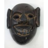 A carved wood mask, H:27cm