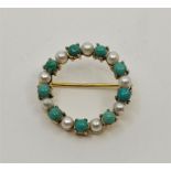 A precious yellow metal, turquoise and pearl brooch, the ring form mount set alternating round