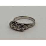 An 18ct. white gold five stone diamond ring, set five round brilliant cut diamonds (ETDW 0.50