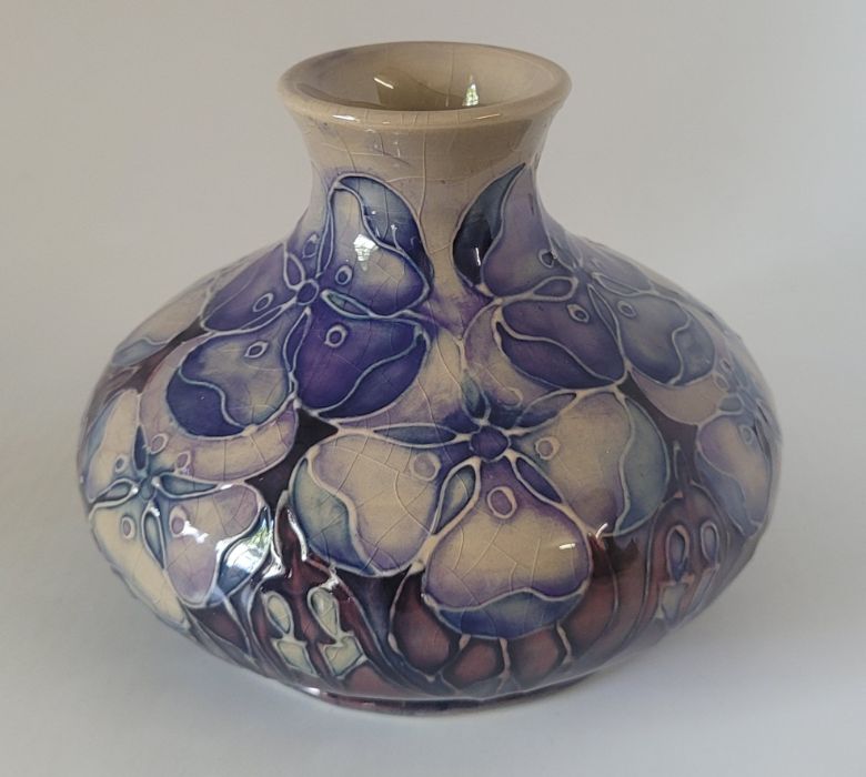 A boxed limited edition Moorcroft vase, decorated in the Tudor Rose pattern , , 10.5 cm high  .