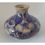 A boxed limited edition Moorcroft vase, decorated in the Tudor Rose pattern , , 10.5 cm high  .