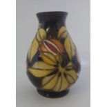 A Boxed  Moorcroft vase titled  " Endangered species "  it is decorated with large yellow autumnal