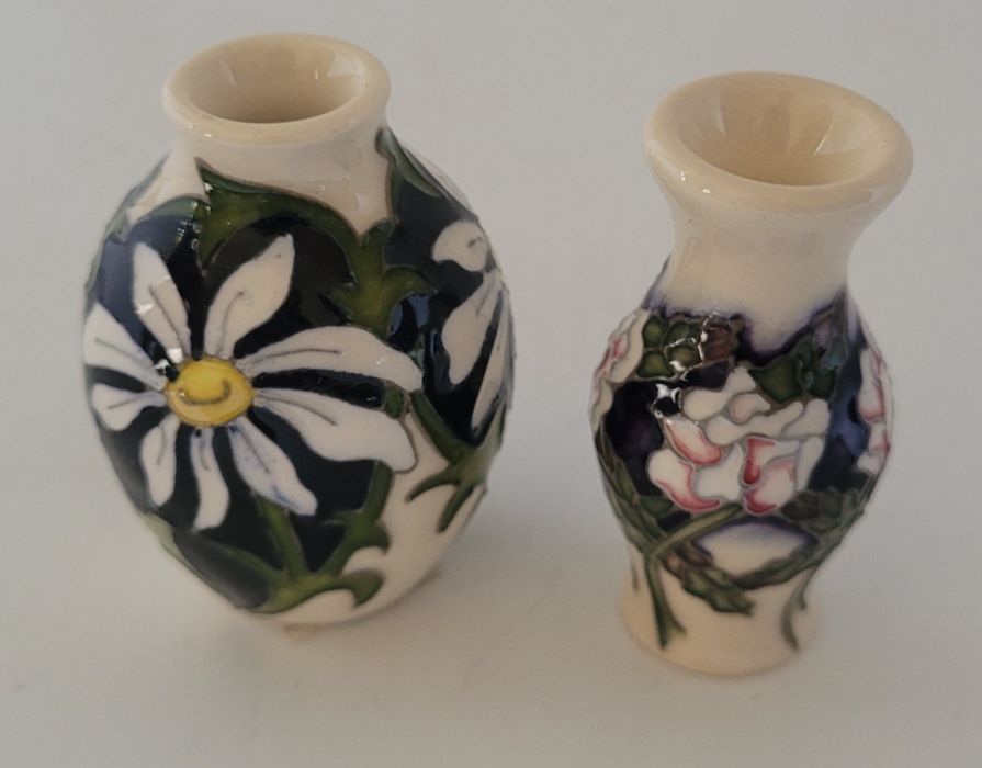 2 boxed miniature Moorcroft vases , to include Months April 2020 Daisy and June 2017 Rose pattern ,