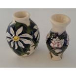 2 boxed miniature Moorcroft vases , to include Months April 2020 Daisy and June 2017 Rose pattern ,