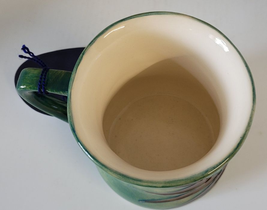 A boxed Moorcroft mug , decorated in the Peacock pattern , designed by Sally Tuffin in 1990 , marked - Image 4 of 5