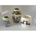 3 pieces of Moorcroft to include a discontinued mini Rhino vase 9cm high , a prancing reindeer mug