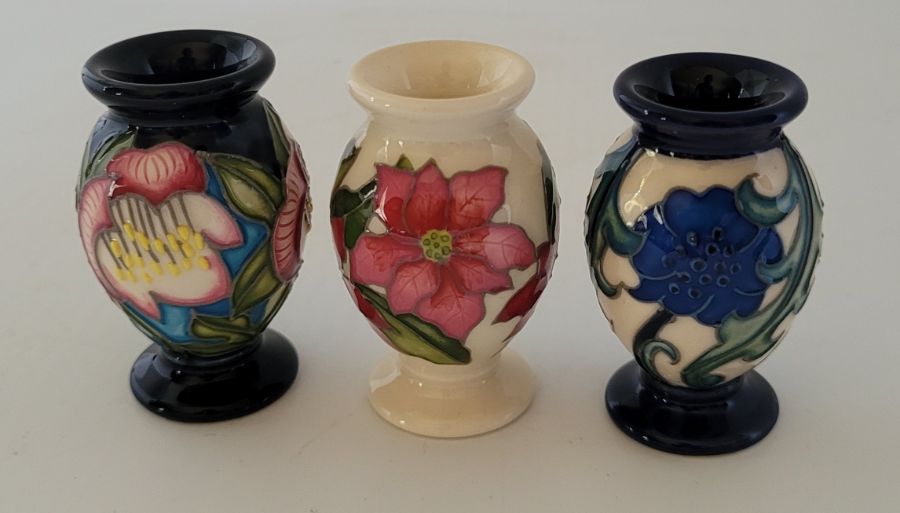 3 boxed miniature Moorcroft vases , to include a "Month December 2020 Pointsettier , forgetme not