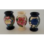 3 boxed miniature Moorcroft vases , to include a "Month December 2020 Pointsettier , forgetme not