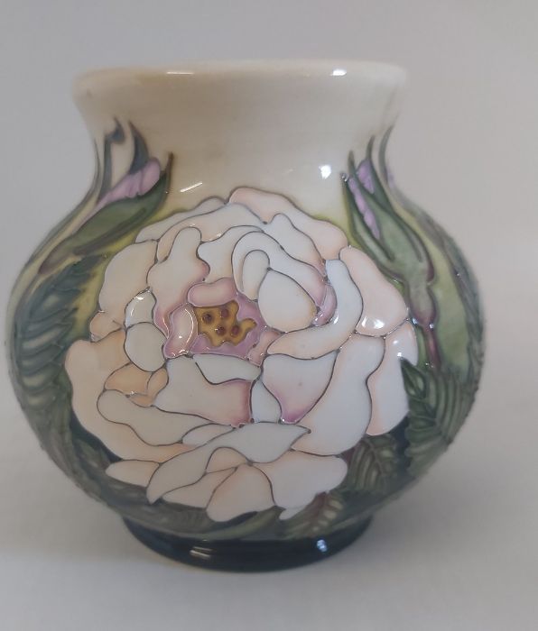 A Boxed Moorcroft Trial vase, titled  " Madam Rose "  it is decorated with colourful bands of a