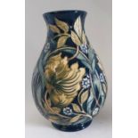 A boxed Master, Pimpernel Perfection Vase. Decorated with leaves and flowers in greens and blues,