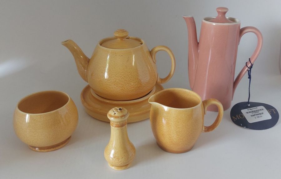 A W Moorcroft salmon pink small coffee pot C1920's, signed in green and a  5 piece of Sunray