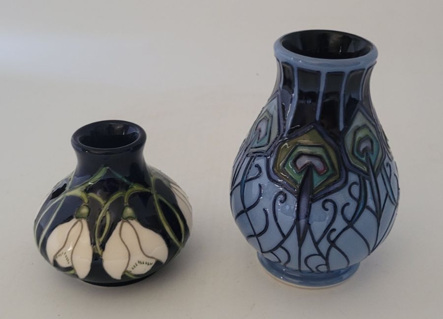 2 boxed Moorcroft vases , pendants snall snowdops dated 2020 5.5cm high and blue peacock 9.5cm