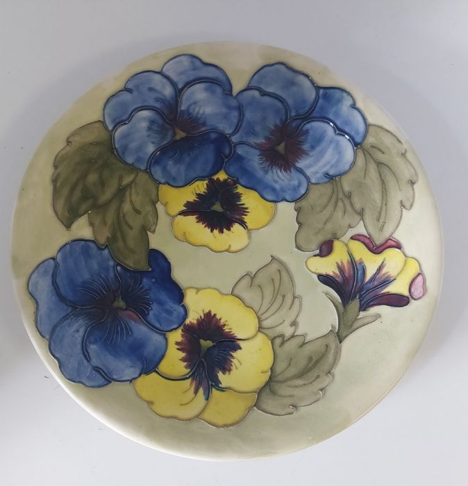 A Walter Moorcroft Pansy revival pattern, Plate C1973. signed WM in green, for the American market