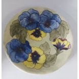 A Walter Moorcroft Pansy revival pattern, Plate C1973. signed WM in green, for the American market