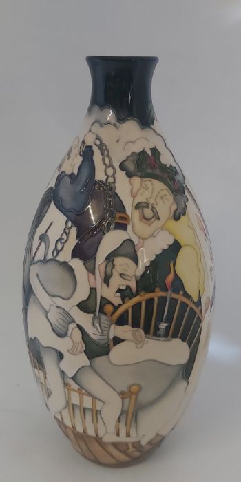 A large boxed Trial Moorcroft vase, titled  " Scrooge "  it is decorated with scenes from Dickens