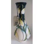 A Trial  " Green Tear " pattern  vase by Moorcroft Decorated with hanging flower heads in whites and