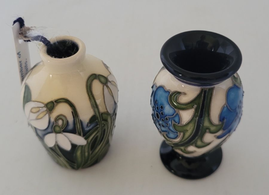 2 boxed miniature Moorcroft vases , to include a Moorcroft collectors club piece , flower of hope