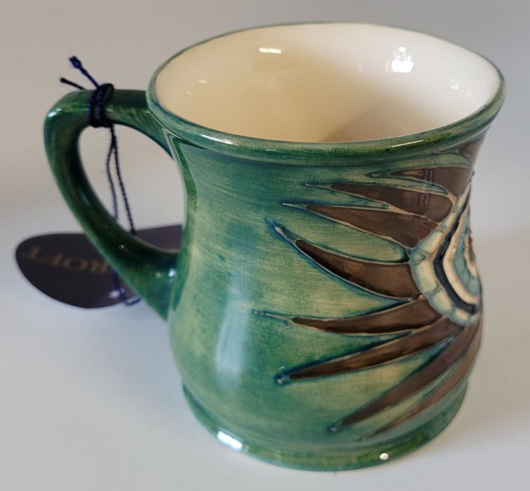 A boxed Moorcroft mug , decorated in the Peacock pattern , designed by Sally Tuffin in 1990 , marked - Image 3 of 5