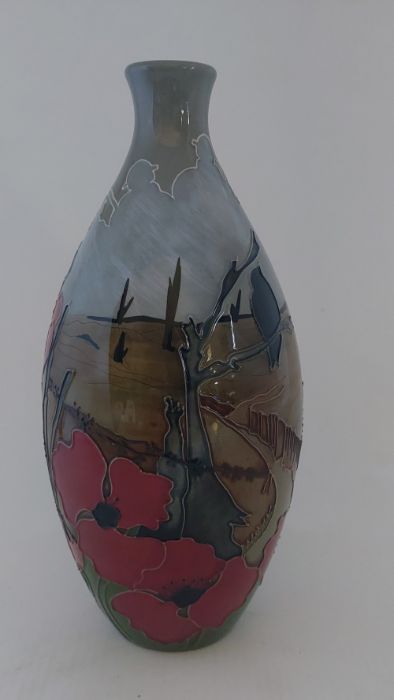 A  boxed trial Moorcroft vase Titled " Lest We Forget " C2013. it is decorated with red poppies