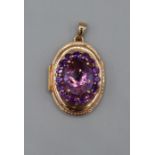 An Italian amethyst set locket in rose-pink metal. Stamped 750 with Italian goldsmith marks.