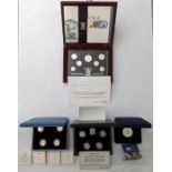 ***AWAY***A collection of four boxes to include. Royal Mint silver proof 2004 £5 crown 100th