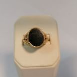 An 18ct gold bloodstone set signet ring with rubbed hallmark. Size M. Approximate weight 6.3 grams.