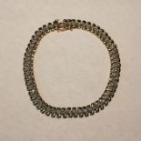 A 9ct gold diamond bracelet. Set with 57, 0.5mm eight cut diamonds. Approximate length (not