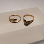 Two diamond set 9ct gold rings. Comprising a 9ct gold serpent ring, set with a single gypsy set,