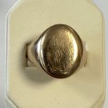 An unmarked yellow metal plain signet ring. Size R. Approximate weight 10 grams.