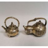 Two miniature white metal Chinese teapots and small pot