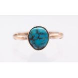 An Early 20th century turquoise and 9ct rose gold solitaire  ring, comprising an off oval cabochon