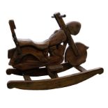 A hardwood child's rocking horse in the shape of a motorcycle, of recent manufacture.
