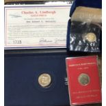 Three Commemorative gold Medallic Issues of two 10ct and one smaller coin of 14ct gold. One with
