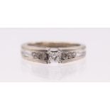 A diamond and 14ct white gold ring, comprising a claw set princess cut diamond approx 0.25ct, to