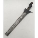 A 19th century kris, likely Malaysian in origin. Carved hardwood handle with gilt brass mount. Steel