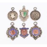 Football: A collection of six hallmarked silver and enameled fob medals to include: Middlesex County