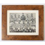 Manchester City: A framed and glazed 1949 Manchester City team photograph, signed by nine members of