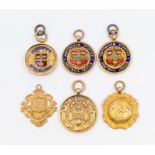 Football: A collection of six 9ct gold hallmarked and enameled medallions and fobs, five having