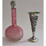 A Victorian cranberry cut glass globular scent bottle with tall slender neck, the Victorian silver